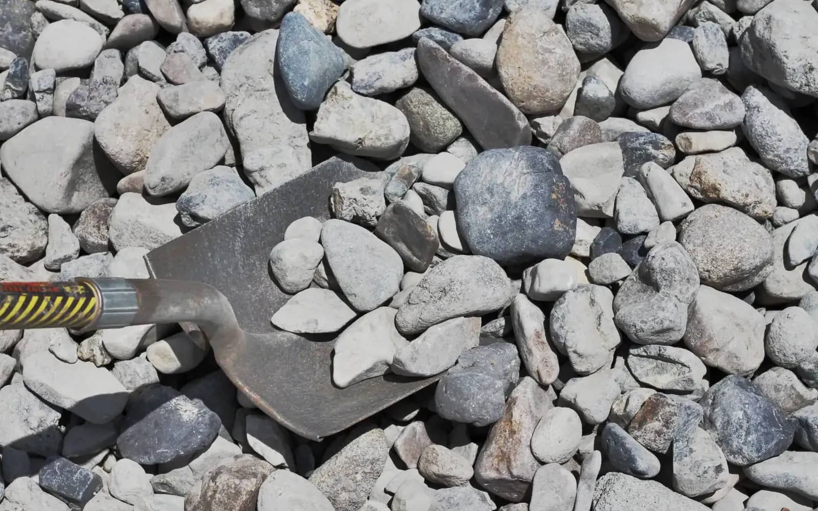 Shovel of 4-inch rock aggregate