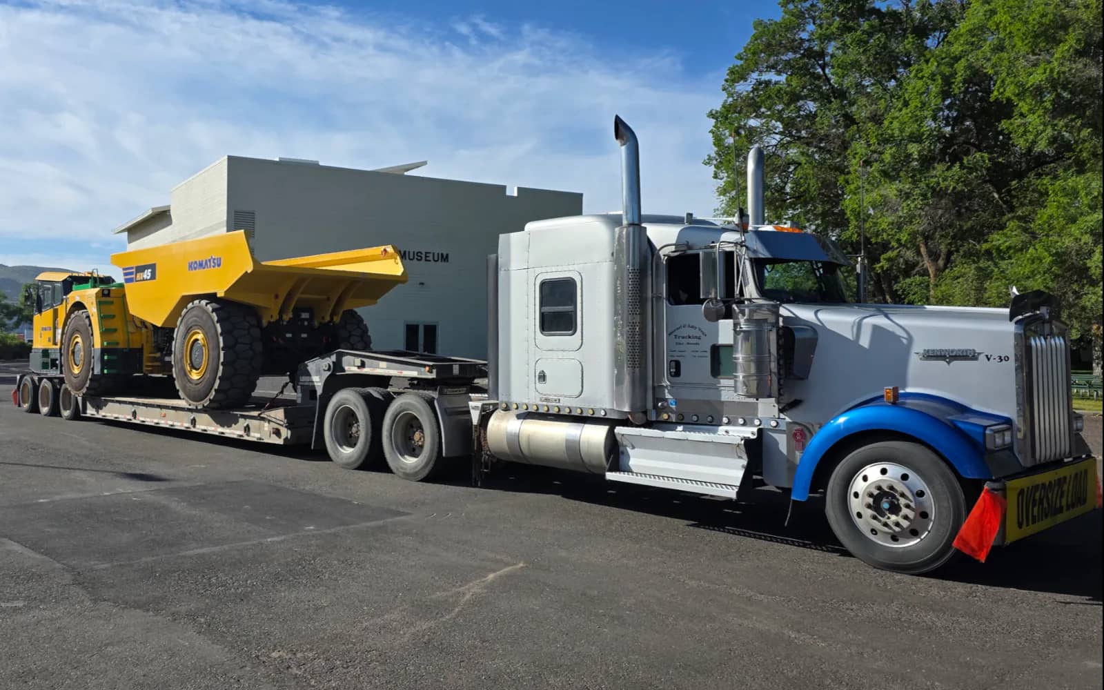 Underground haul truck loaded on a lowboy